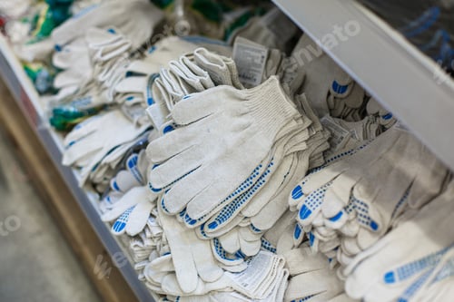 Preview: Working Protective gloves. A man in a hardware store buys gloves.