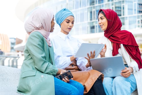 Preview: Beautiful muslim girl wearing hijab bonding outdoors