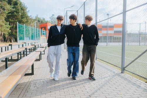 Preview: Teenage Friends Hanging Out and Having Fun by the School Fence