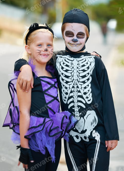 Preview: Cute little trick-or-treaters. Cute boy and girl dressed up for Halloween.