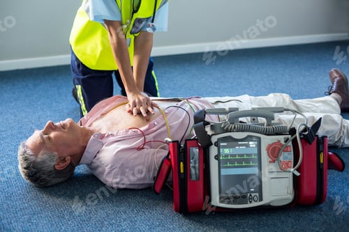 Preview: Paramedic using an external defibrillator during cardiopulmonary resuscitation