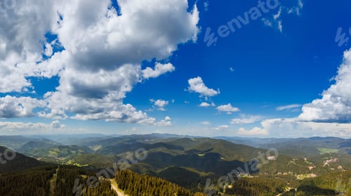 Preview: Panorama on mountain valley sheltered by vegetation and forests with village of Smolyan