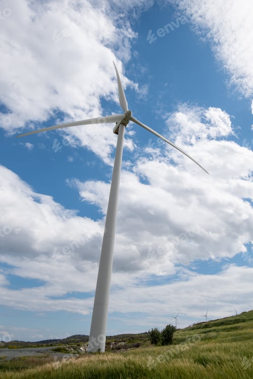 Preview: Windmills power generators on a turbine farm generating electricity from wind. Alternative renewable