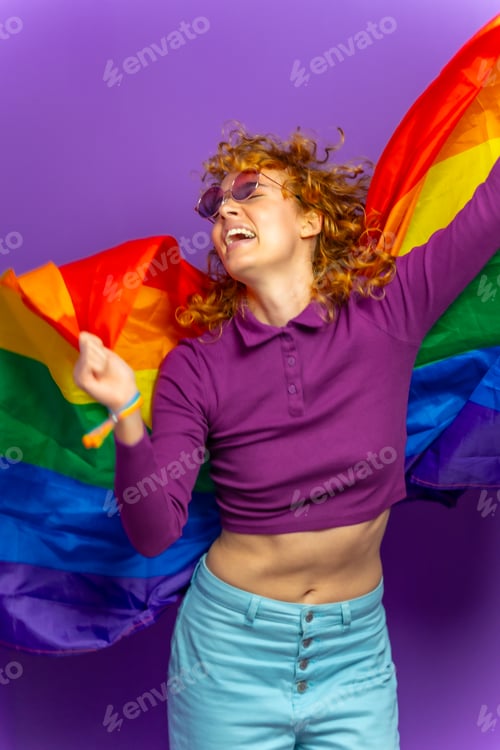 Preview: Woman dancing raising lgbt rainbow flag