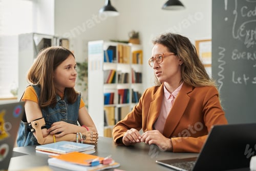Preview: Caring Teacher Talking to Girl