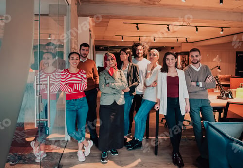 Preview: A diverse group of successful business people in a modern glass office.