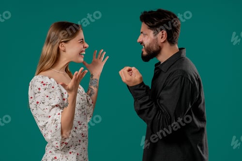 Preview: Grumpy blonde woman yelling with man. Irritated boyfriend, young couple on green