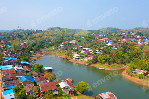 Preview: Aerial top view of houses in Mon village, Kanchanaburi, Thailand in urban city town in Asia