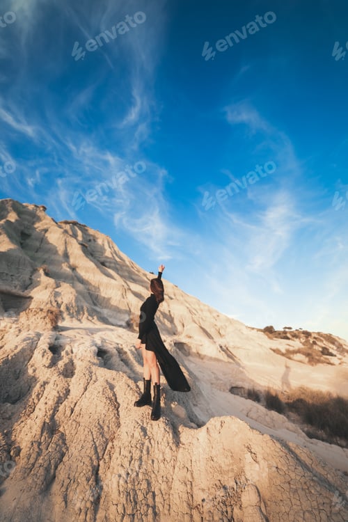Preview: Happy woman enjoying life and freedom outdoor at sunset