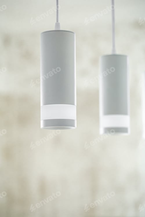 Preview: Chandelier in the interior of the room, lamps in white shades.