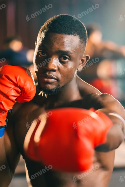 Preview: Muscular african american male boxer wearing boxing gloves, Sports workout and bodybuilding