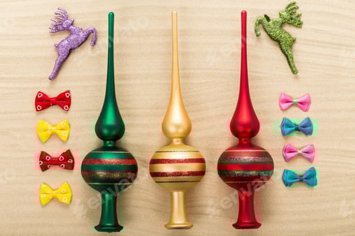 Preview: Christmas tree toppers on waved sand.