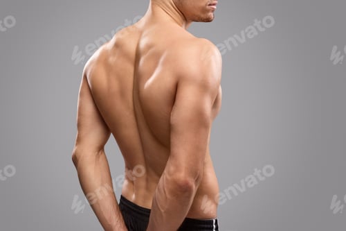 Preview: Crop athlete demonstrating back muscles