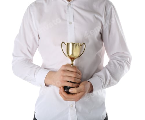 Preview: Man with golden trophy cup on white background, closeup