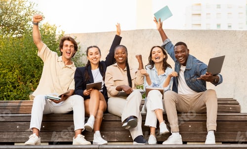 Preview: Thrilled multiracial group of students celebrating results of exams