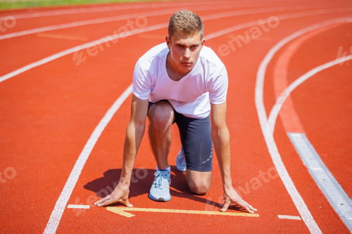 Preview: Male Runner at the Starting Line on Track – Athlete Focused on Race, Motivation and Competition