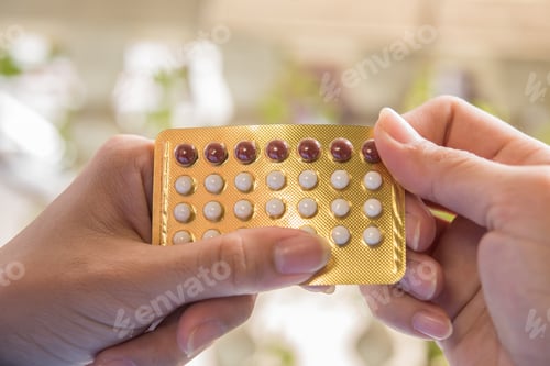 Preview: Woman hand holding a contraceptive panel prevent pregnancy