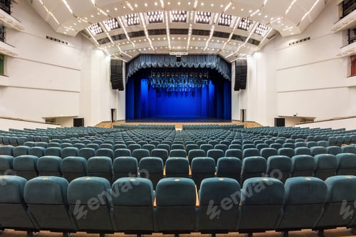 Preview: Interior of a white conference concert hall or theatre with blue scene and green seats