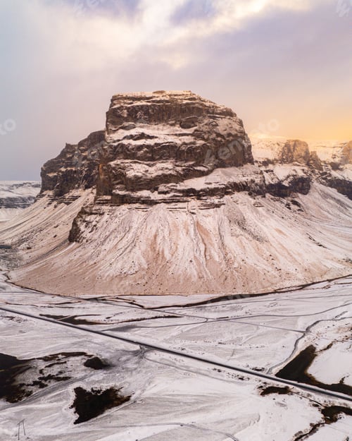 Preview: Majestic snow-covered Icelandic mountain at sunset