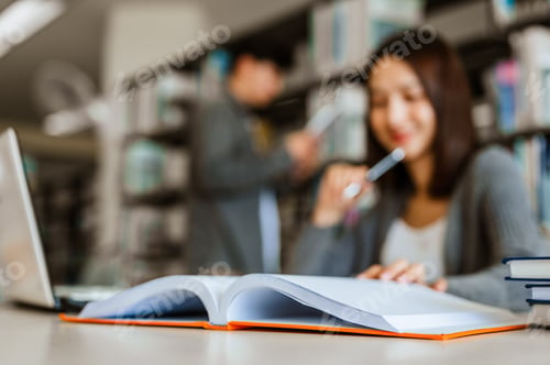Preview: Asian woman students are reading and discussing about exam preparation.she thinking of Questions tes