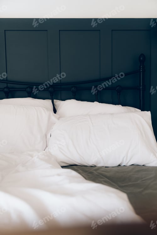 Preview: Soft pillows and duvet on comfortable bed