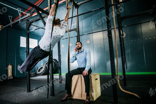 Preview: Busiiness people training in gym