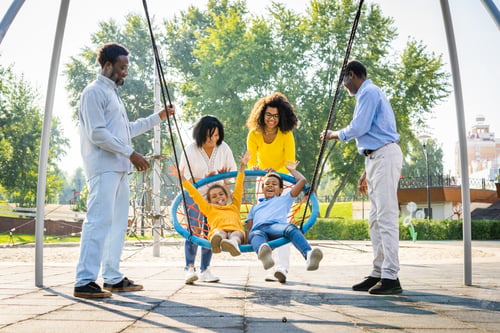 Preview: Beautiful happy african american family bonding at the park