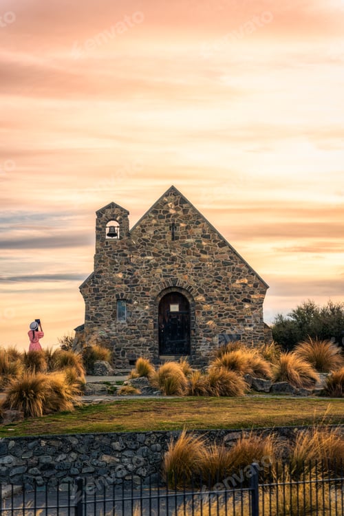 Preview: Church of the good shepherd with female tourist enjoying in the morning at Lake Tekapo, New Zealand