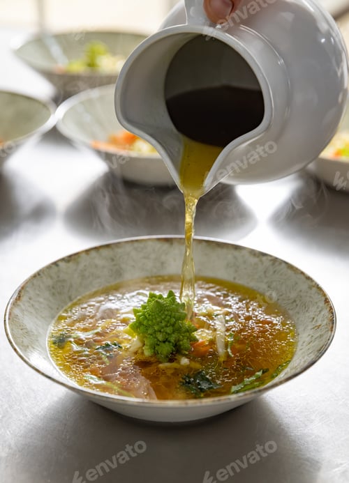 Preview: Pouring broth on fresh salad