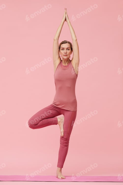 Preview: Mature Woman Enjoying Yoga on Pink