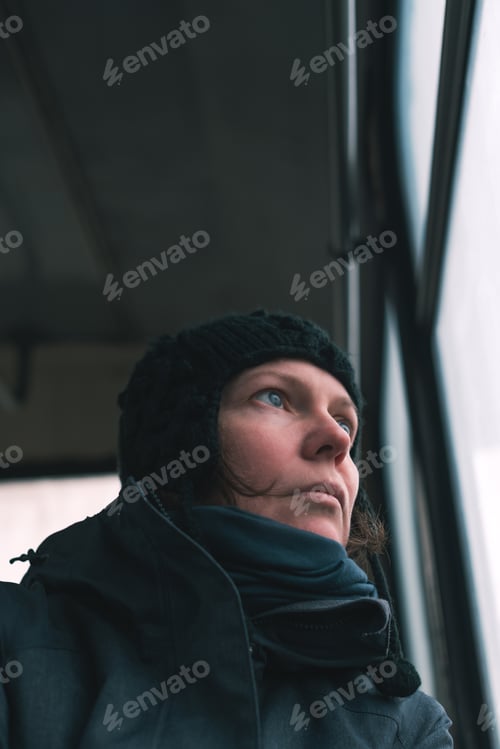 Preview: Sad woman on the bus looking through window