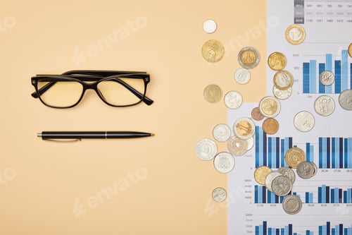 Preview: top view of papers, pen, coins and glasses on table