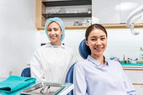 Preview: Portrait of Asian young woman patient and dentist at health care clinic.