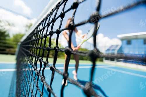Preview: Young woman playing tennis