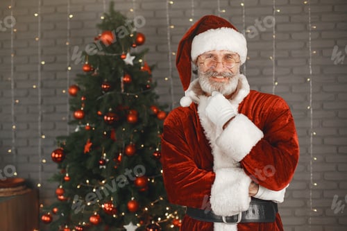 Preview: Man in santa claus costume looking at the camera
