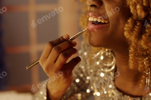 Preview: Applying Lipstick in Dimly Lit Room Setting