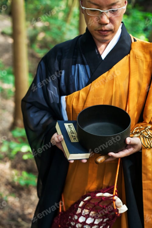 Preview: Buddhist monk carrying an alms bowl