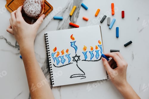 Preview: A girl drawing a celebration card with menorah and candles for Happy Hanukkah holiday. N