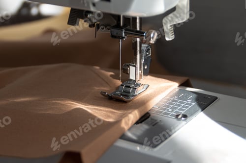 Preview: sewing machine close up view with natural sunlight, slow fashion and home sewing concept