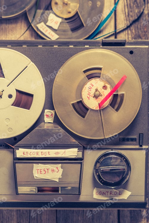 Preview: Classic reel audio recorder and a used rolls of tape.