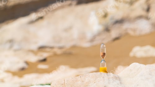 Preview: Sand running through a old hourglass measuring passing time and counting down to deadline, Save time