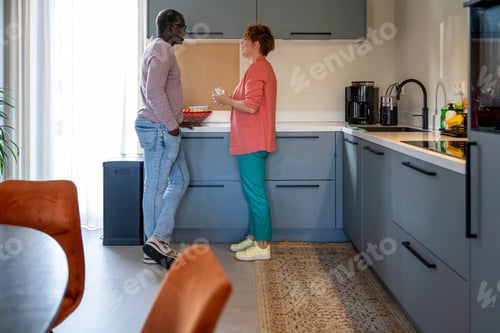 Preview: Mixed race parents in the kitchen having an intense conversation