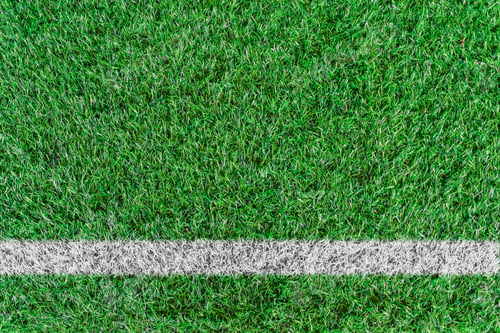 Preview: Top view of white stripe on green soccer field