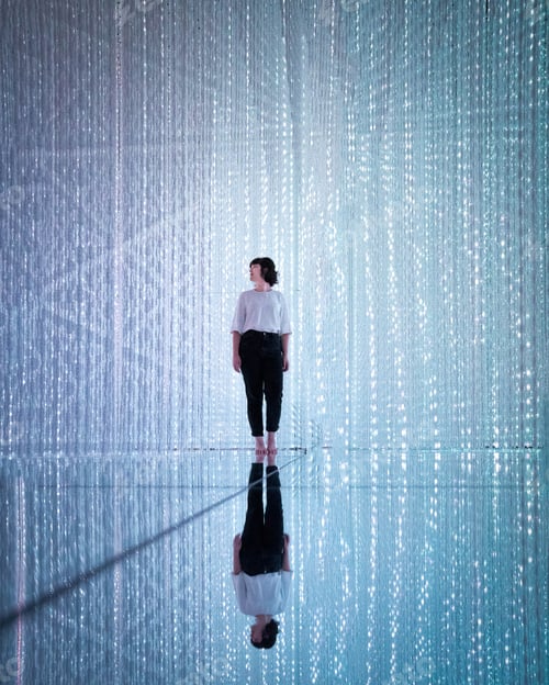 Preview: Woman standing against blue background