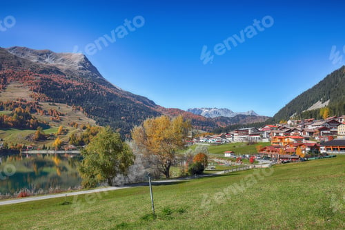 Preview: Picturesque autumn view of San Valentino village and Muta or Haidersee lake.