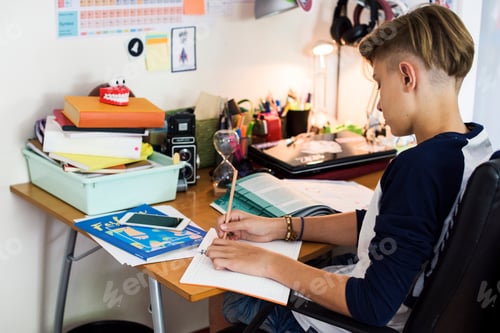 Preview: Young caucasian boy doing homework