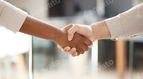 Preview: Shot of two unrecognisable businesspeople shaking hands in an office