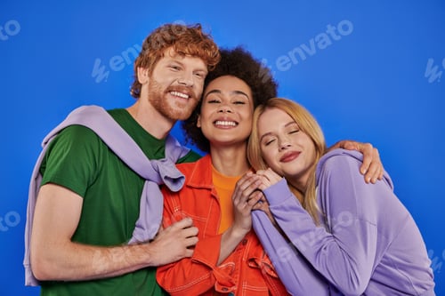 Preview: polyamory relationships, positive multiracial women and redhead man looking at camera on blue