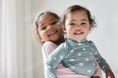Preview: A sibling is a forever friend. Shot of two little sisters spending time together at home.