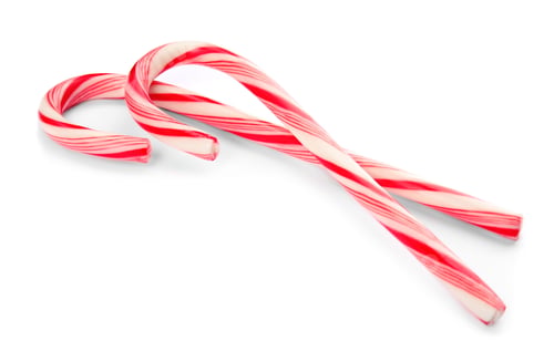 Preview: Tasty candy canes on white background. Festive treat